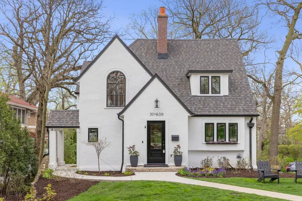 a view of house with yard outdoor seating and swimming pool