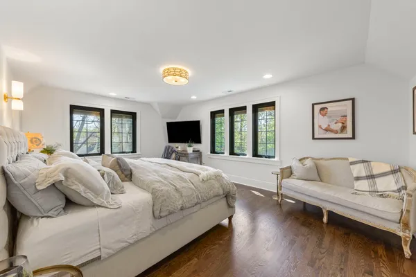 a bedroom with a bed and a table
