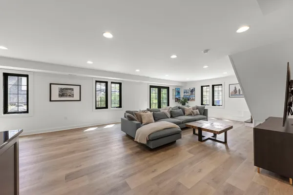 a bedroom with furniture and a flat screen tv