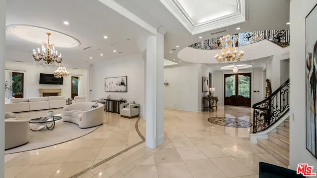 a view of a livingroom with furniture and a flat screen tv