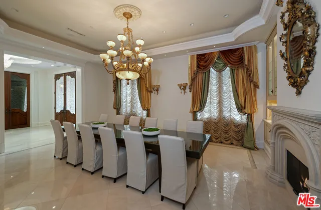 a view of living room with furniture and chandelier