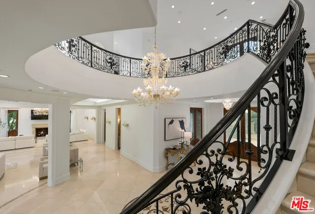 a view of entryway and hall with a dining table