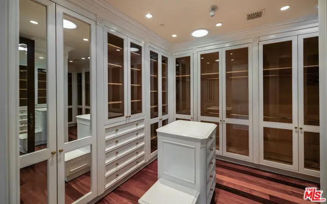 a bathroom with a sink and a large mirror