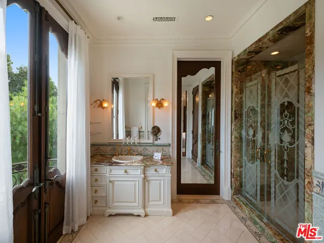 a view of a hallway and a livingroom with furniture