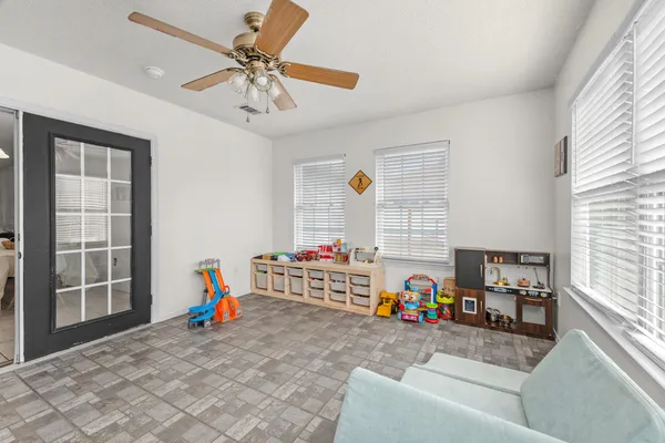a living room with furniture and a window