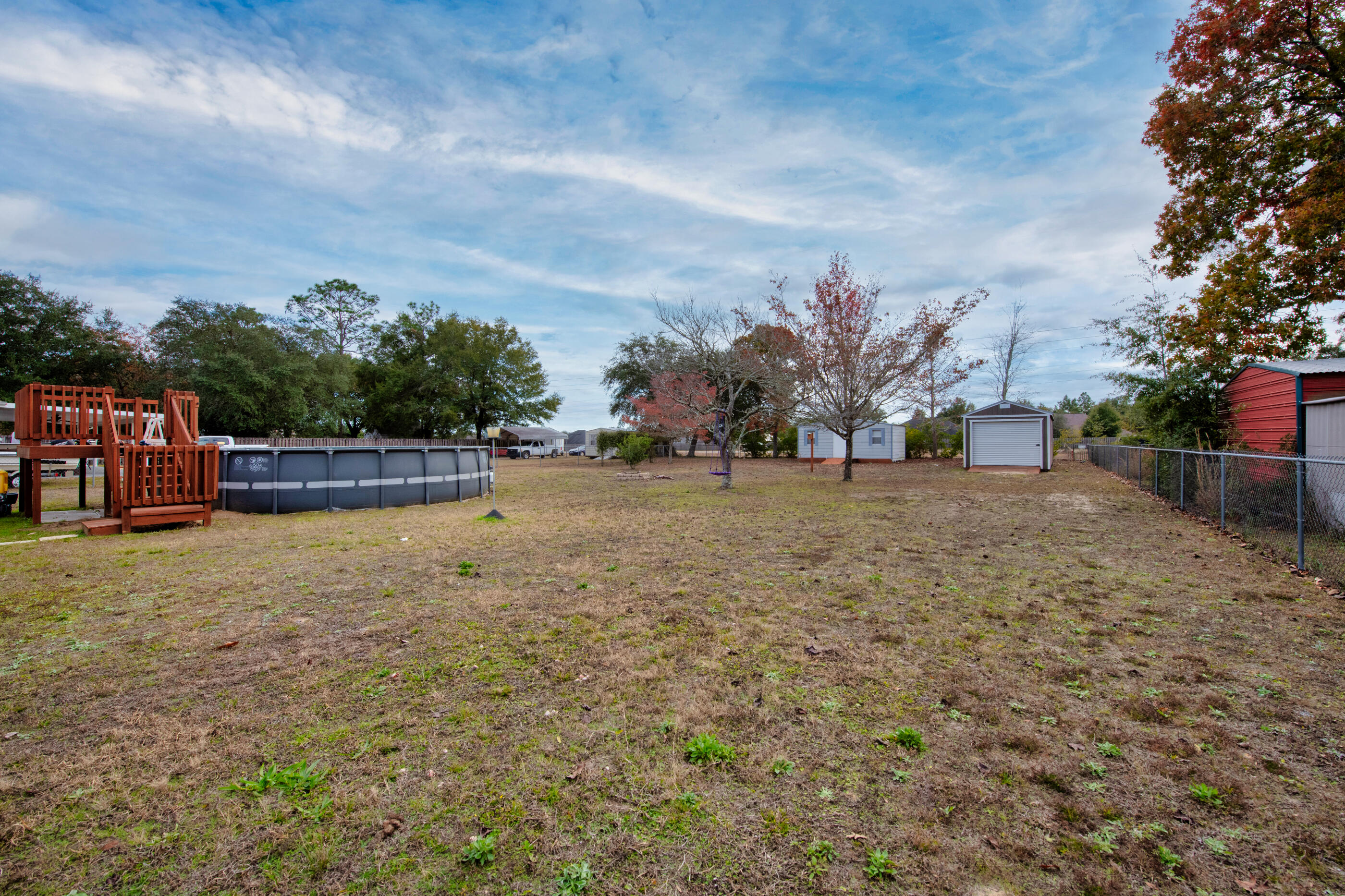 400 Brown Place Crestview, FL 32539 - Photo 22 of 24 a view of outdoor space with deck and yard