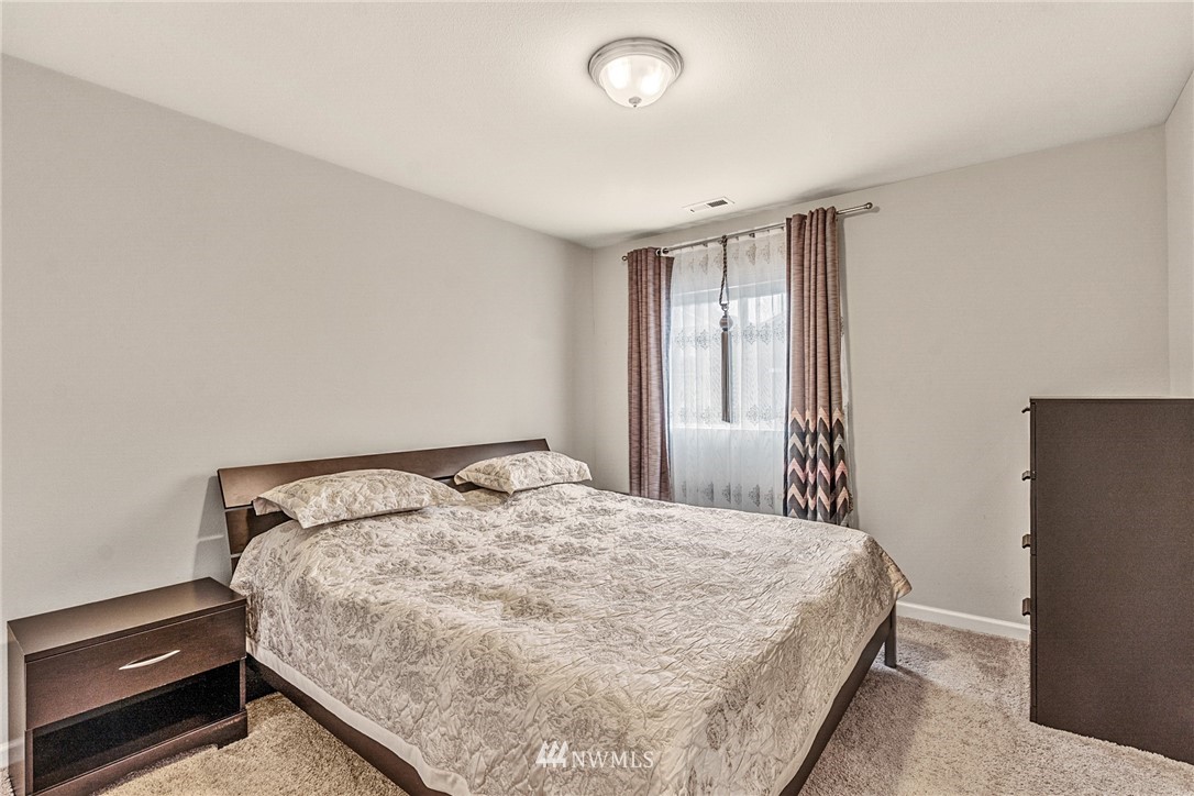 3627 202nd Pl S East Bothell, WA 98012 - Photo 19 of 38 a bedroom with a bed and a window