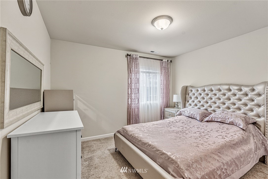 3627 202nd Pl S East Bothell, WA 98012 - Photo 20 of 38 a bedroom with a bed and window