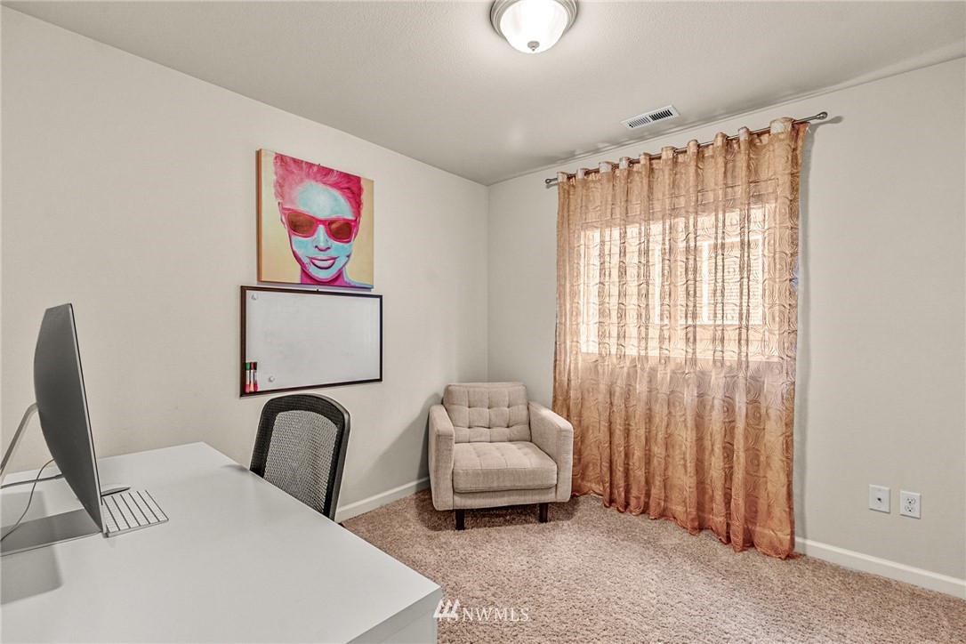 3627 202nd Pl S East Bothell, WA 98012 - Photo 24 of 38 a bedroom with furniture and a window
