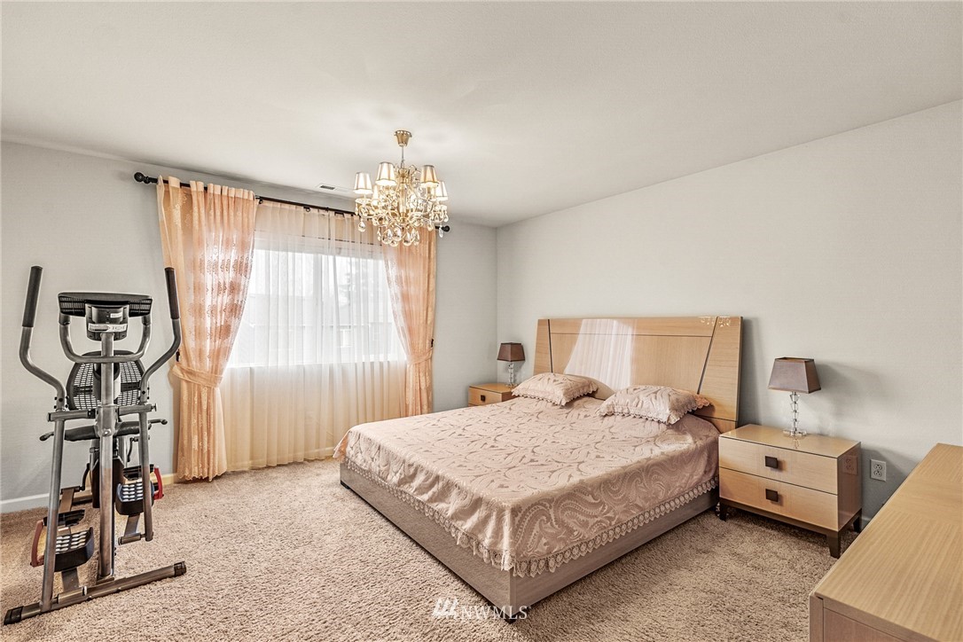 3627 202nd Pl S East Bothell, WA 98012 - Photo 26 of 38 a bedroom with a bed and a table