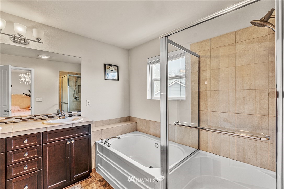 3627 202nd Pl S East Bothell, WA 98012 - Photo 29 of 38 a spacious bathroom with a tub sink and mirror