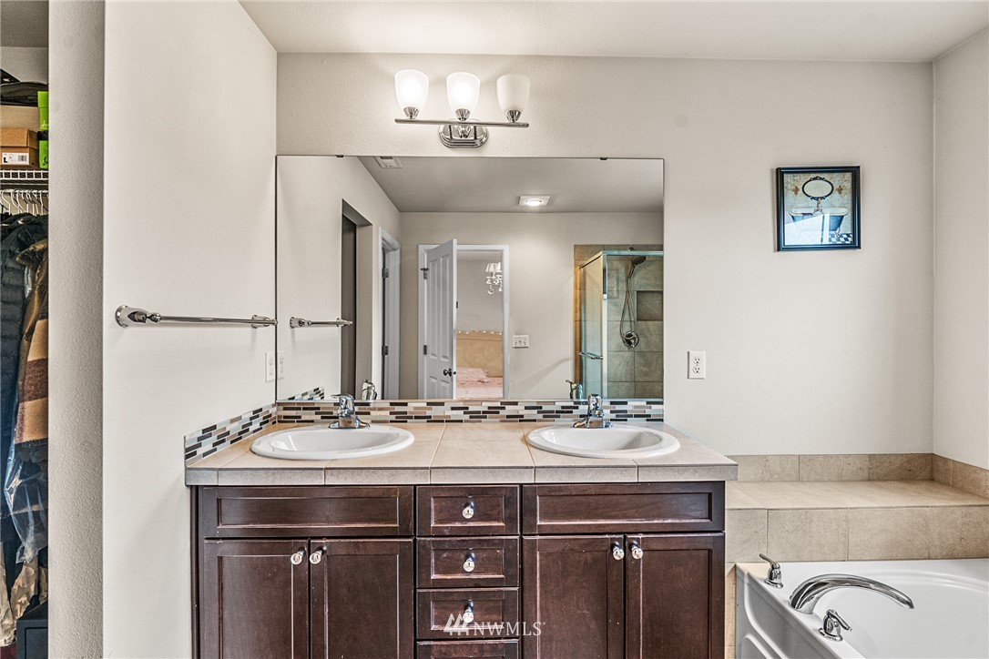 3627 202nd Pl S East Bothell, WA 98012 - Photo 30 of 38 a bathroom with a sink and a mirror
