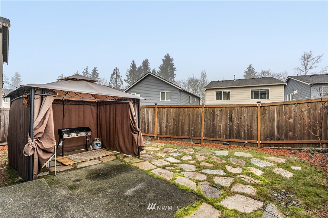 3627 202nd Pl S East Bothell, WA 98012 - Photo 34 of 38 a view of a house with wooden fence