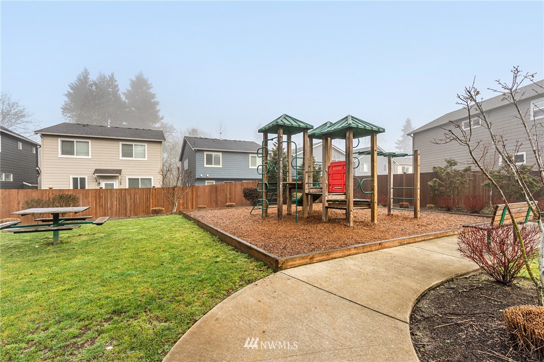 3627 202nd Pl S East Bothell, WA 98012 - Photo 37 of 38 a view of a house with a swimming pool and a porch