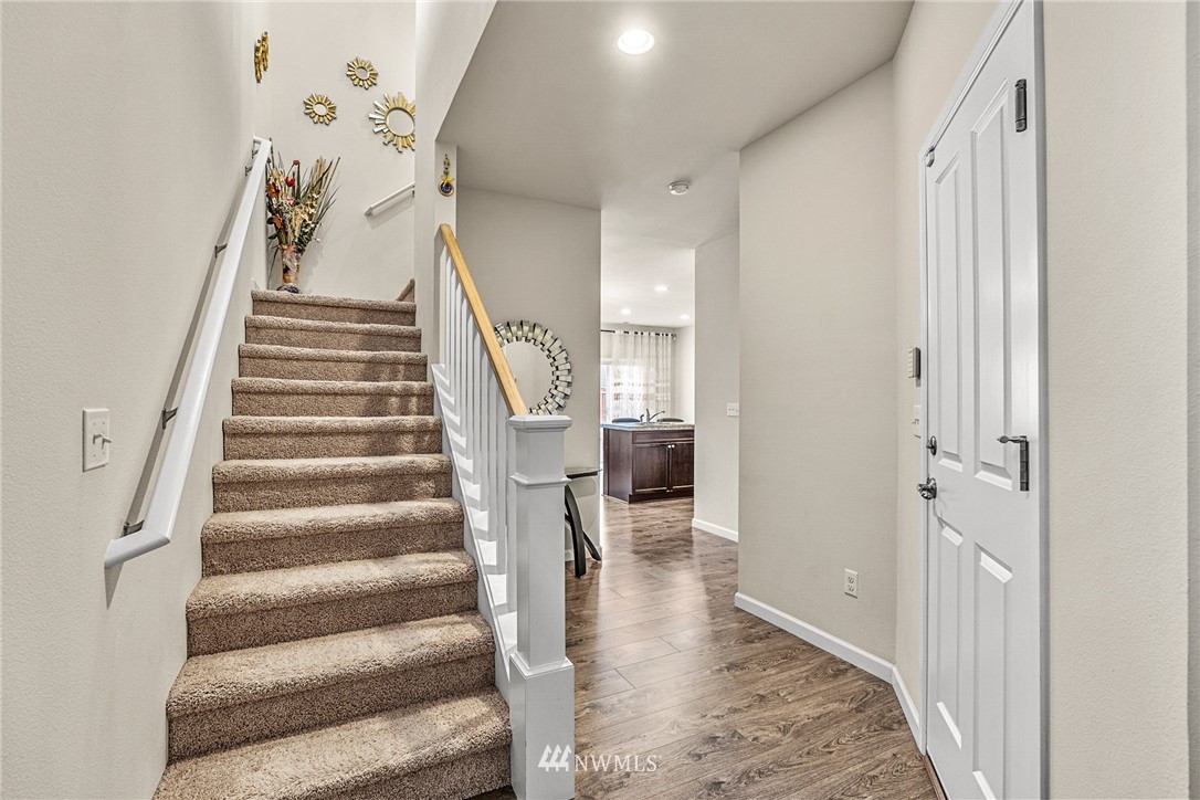 3627 202nd Pl S East Bothell, WA 98012 - Photo 5 of 38 a view of entryway and hall with wooden floor