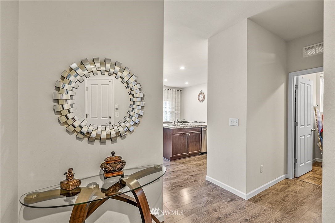 3627 202nd Pl S East Bothell, WA 98012 - Photo 6 of 38 a room with a table and a chandelier