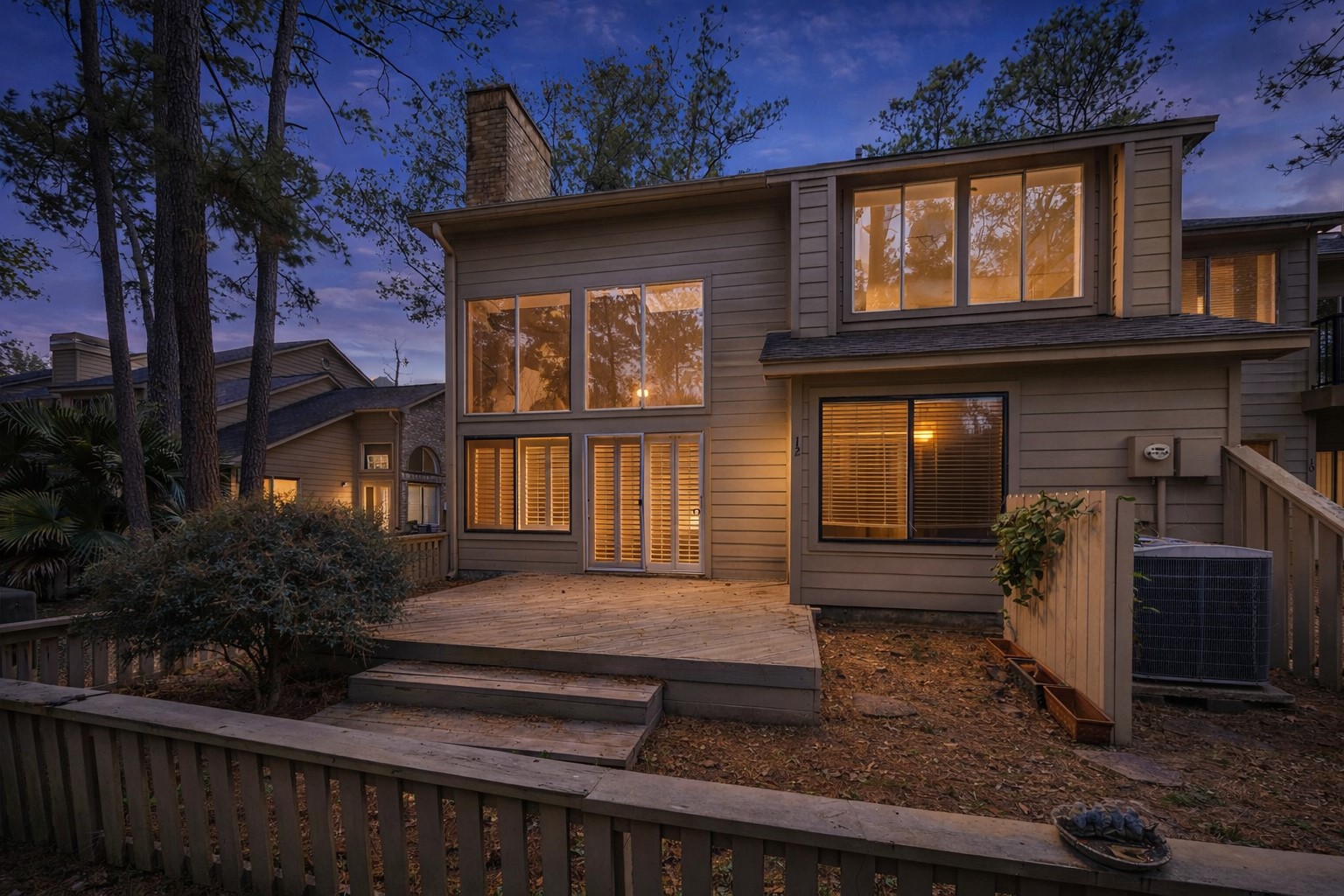 12 Lakeridge Drive Spring, TX 77381 - Photo 21 of 24 Outdoor living space featuring a private deck and mature trees, ideal for entertaining with seamless indoor-outdoor flow.
