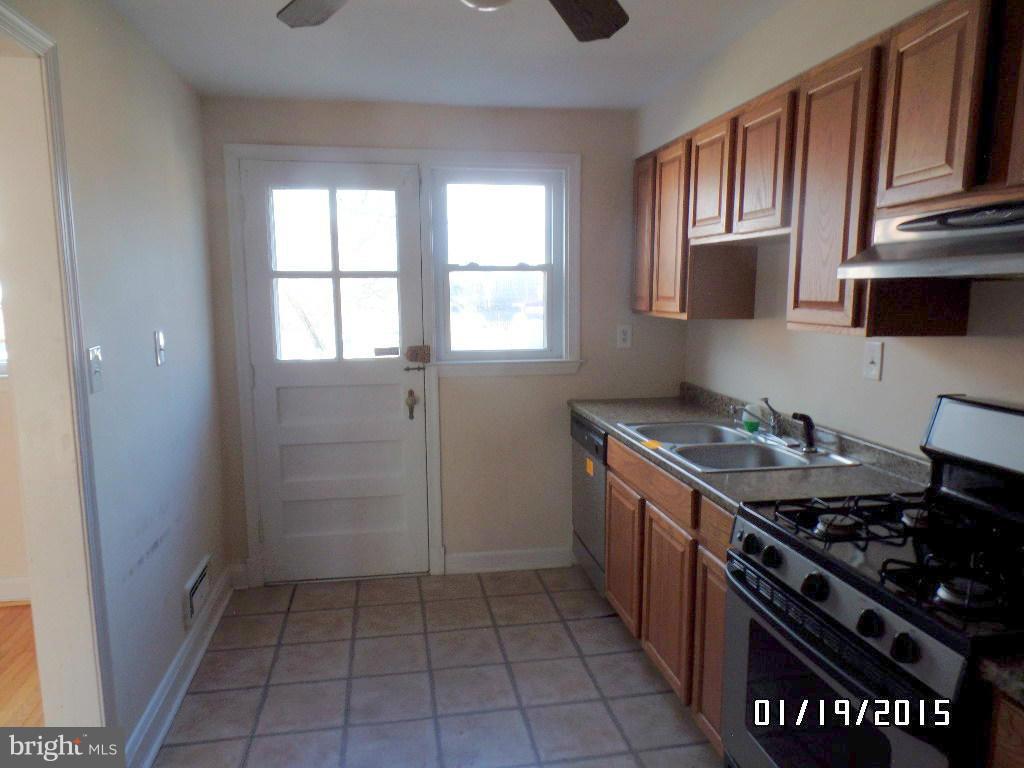 1221 Harwall Road Baltimore, MD 21207 - Photo 3 of 10 a kitchen with a stove and a sink