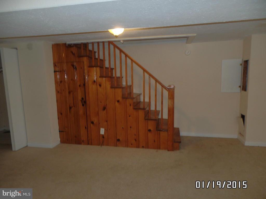 1221 Harwall Road Baltimore, MD 21207 - Photo 4 of 10 a view of a hallway with wooden floor and entryway