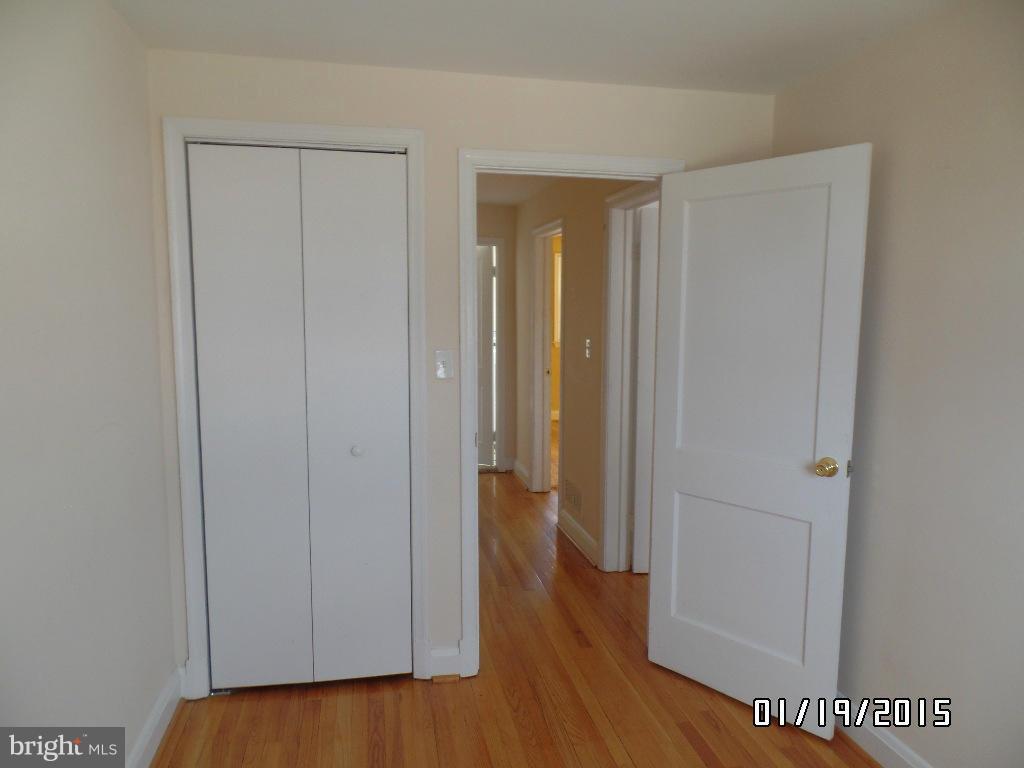 1221 Harwall Road Baltimore, MD 21207 - Photo 8 of 10 a view of a hallway with wooden floor