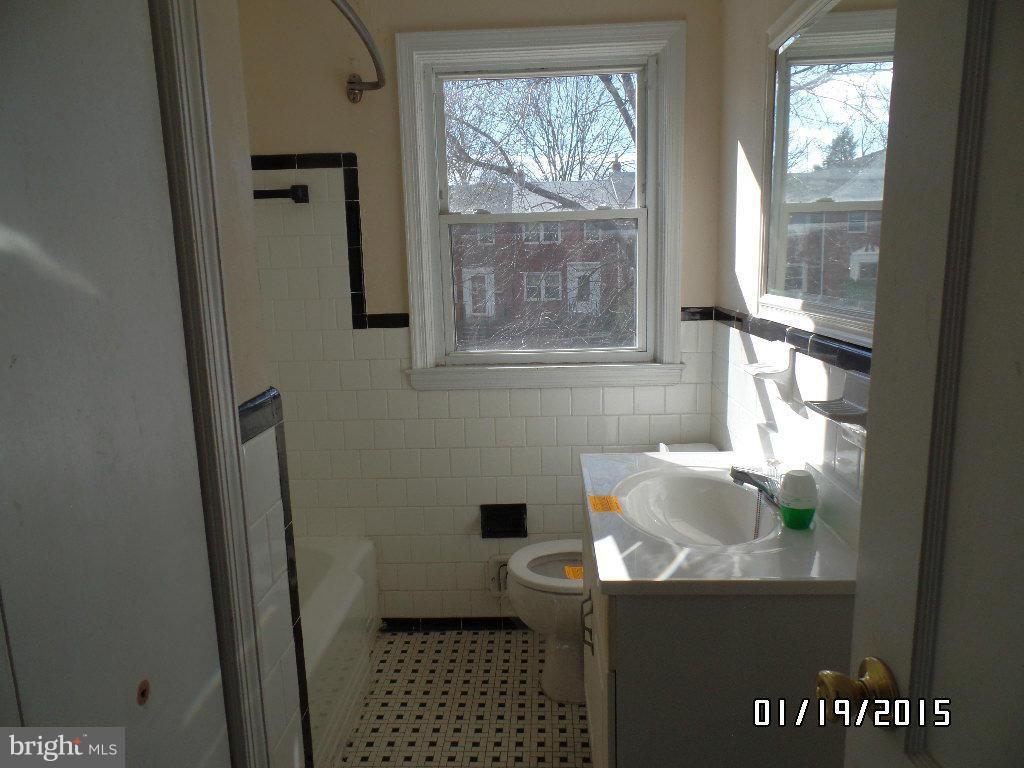 1221 Harwall Road Baltimore, MD 21207 - Photo 9 of 10 a bathroom with a sink and a toilet