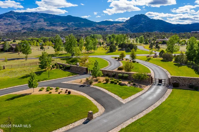 a view of a swimming pool with a yard