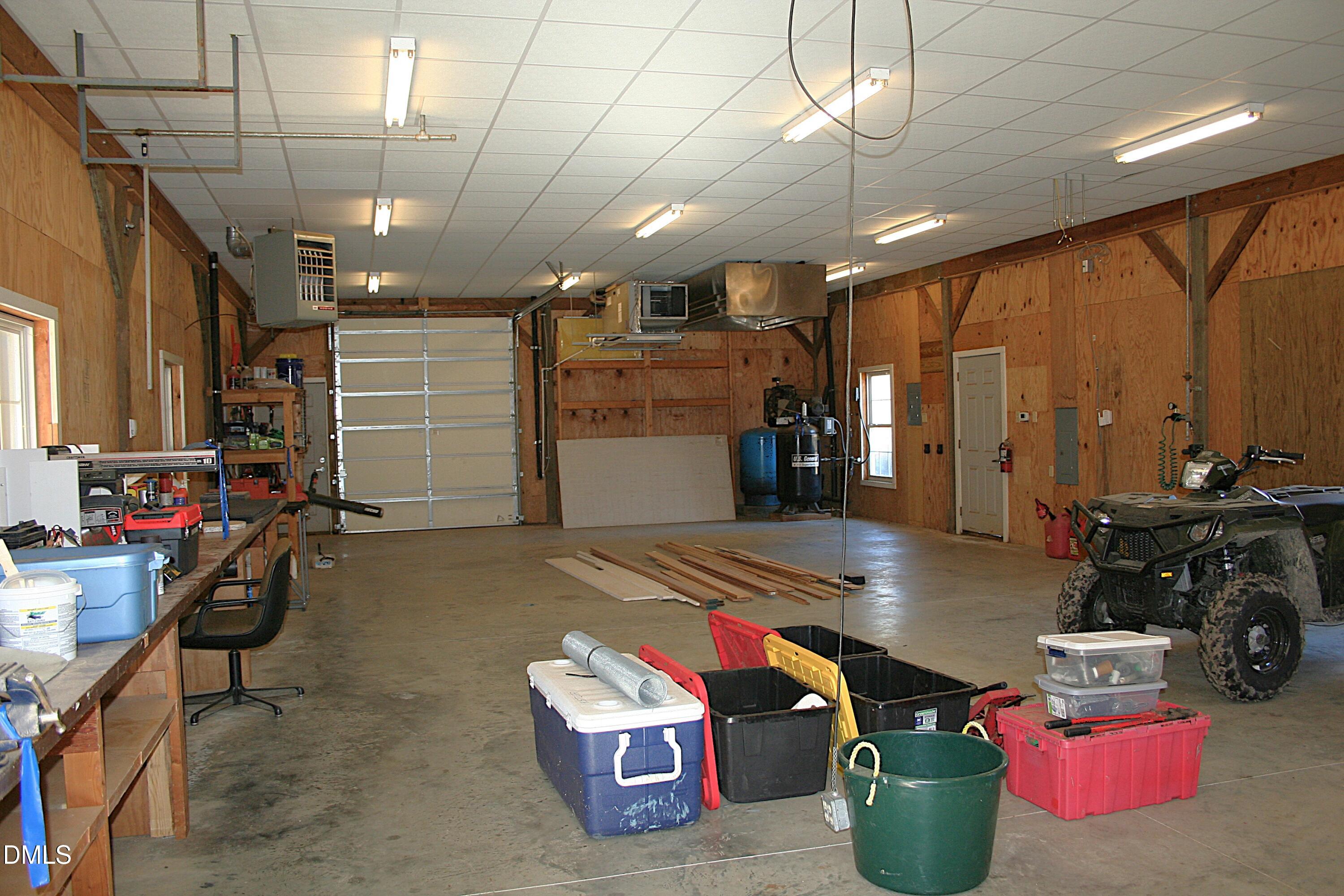 220 Jordan Narron Road Selma, NC 27576 - Photo 75 of 87 a room with lots of furniture and a chandelier
