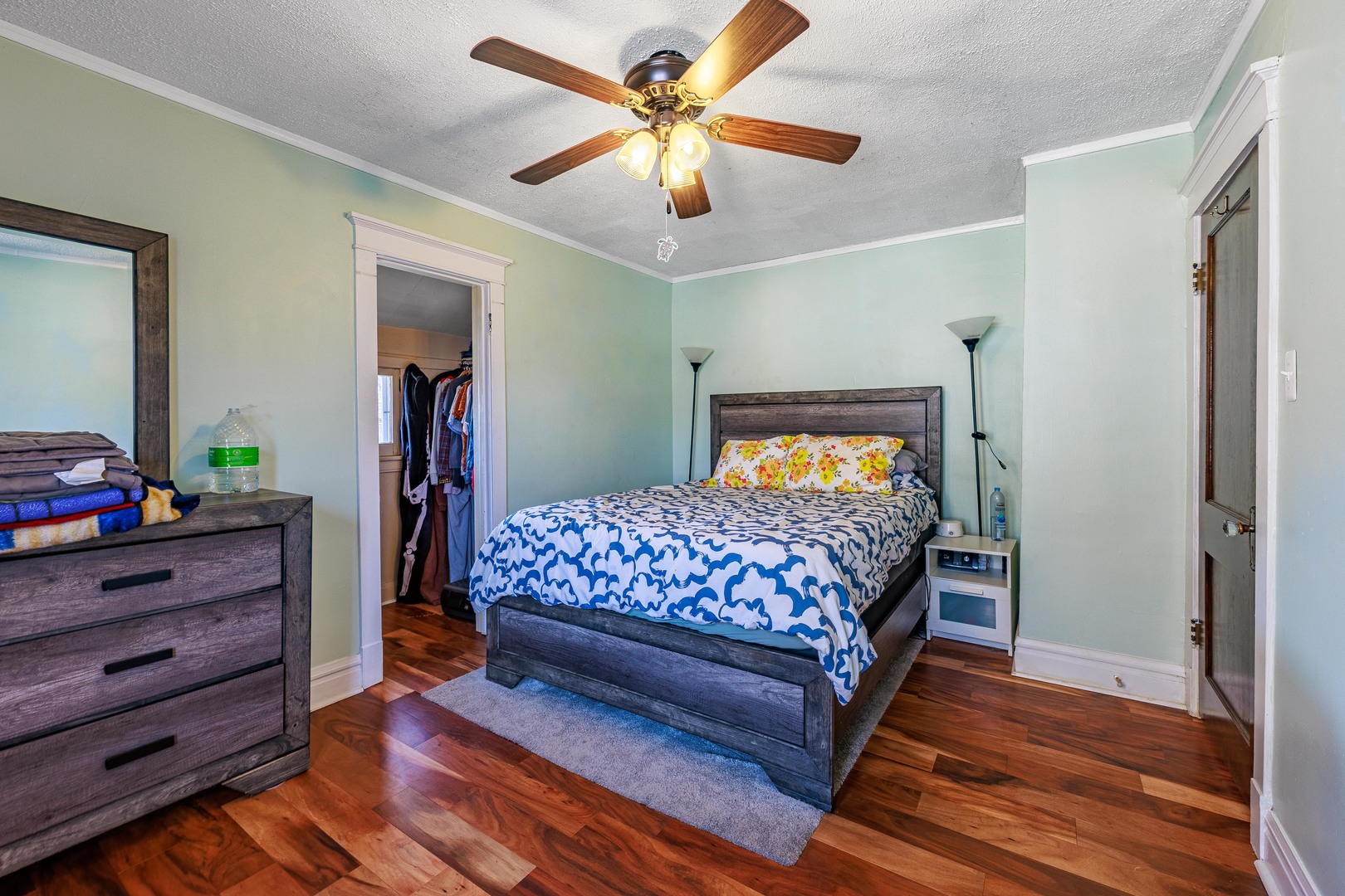 410 Repton Road Riverside, IL 60546 - Photo 17 of 30 a bedroom with a bed and a chandelier