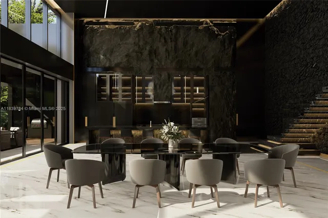 a dining room with furniture and rug