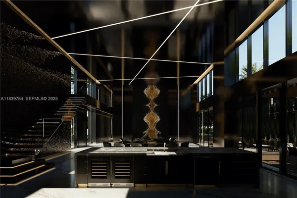 a kitchen with lots of counter top space and a view of living room