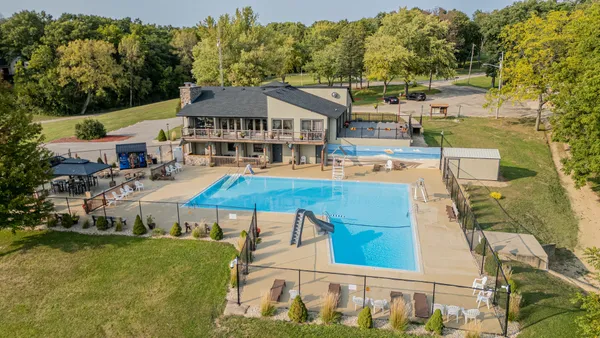a view of a swimming pool with a patio