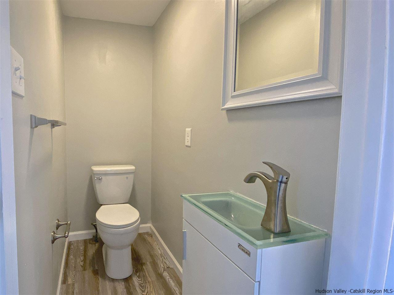 96 Rinaldi Boulevard Poughkeepsie, NY 12601 - Photo 11 of 23 a bathroom with a sink and a toilet