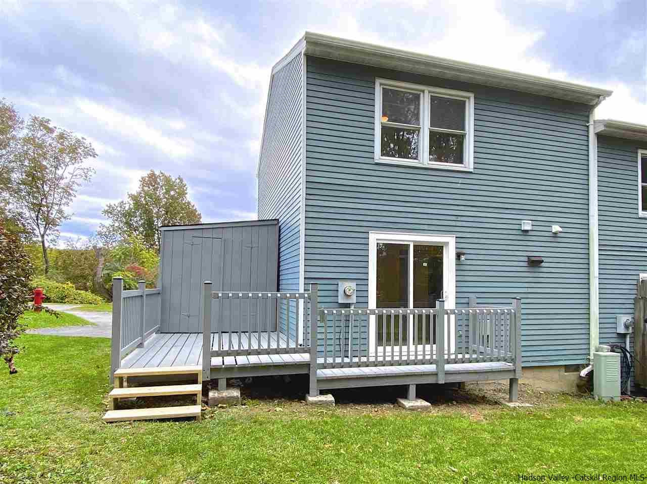 96 Rinaldi Boulevard Poughkeepsie, NY 12601 - Photo 21 of 23 a view of backyard with a garden and deck