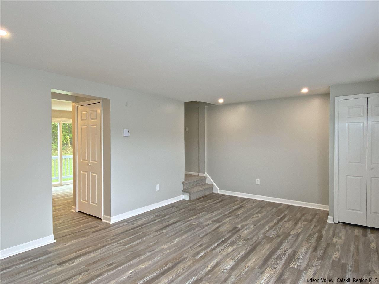96 Rinaldi Boulevard Poughkeepsie, NY 12601 - Photo 5 of 23 a view of an empty room with wooden floor and closet