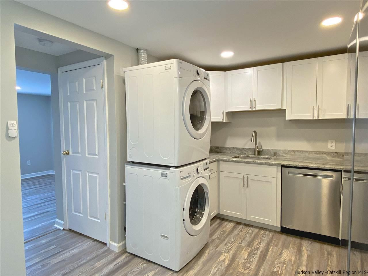 96 Rinaldi Boulevard Poughkeepsie, NY 12601 - Photo 10 of 23 a kitchen with a stove top oven sink and cabinets