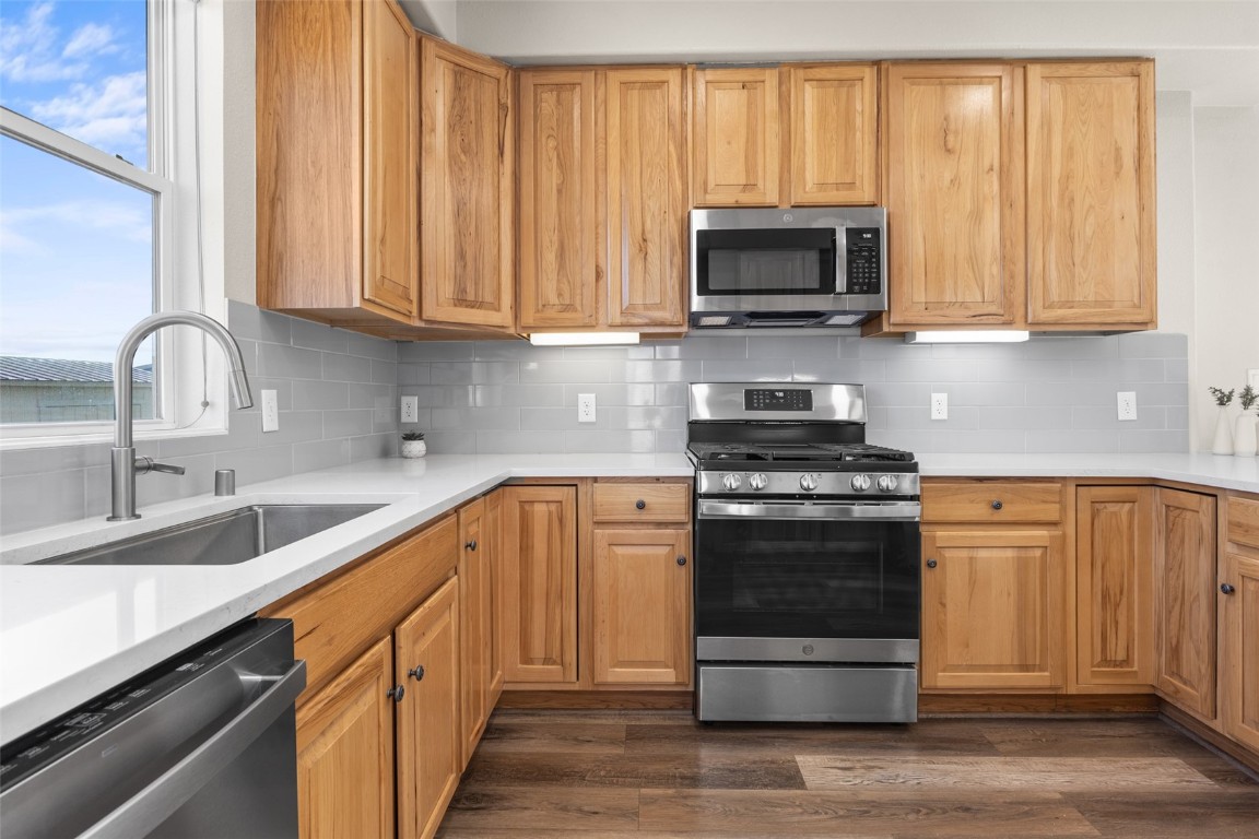 324 Little Bend Road Hayden, CO 81639 - Photo 11 of 35 a kitchen with stainless steel appliances granite countertop a stove a sink and a microwave