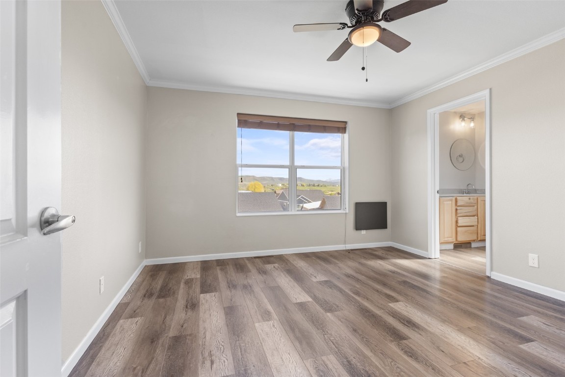 324 Little Bend Road Hayden, CO 81639 - Photo 17 of 35 a view of empty room with wooden floor and fan