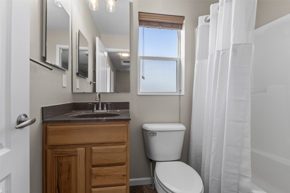 324 Little Bend Road Hayden, CO 81639 - Photo 27 of 35 a bathroom with a granite countertop toilet sink and mirror