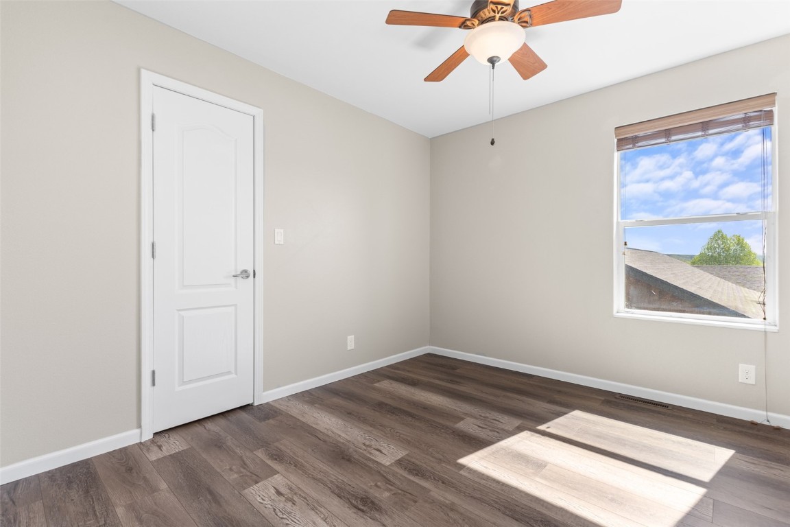 324 Little Bend Road Hayden, CO 81639 - Photo 28 of 35 an empty room with a window and a ceiling fan
