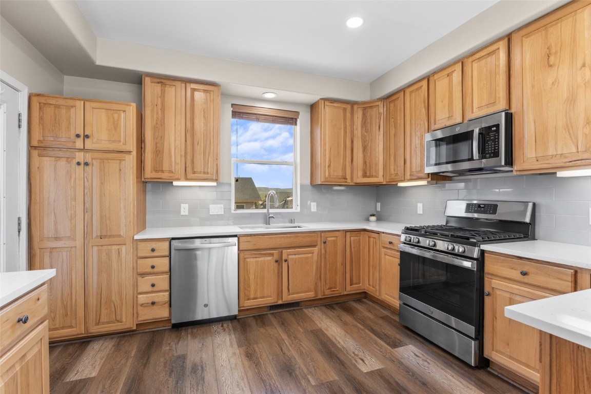 324 Little Bend Road Hayden, CO 81639 - Photo 9 of 35 a kitchen with stainless steel appliances granite countertop a stove a sink and a microwave
