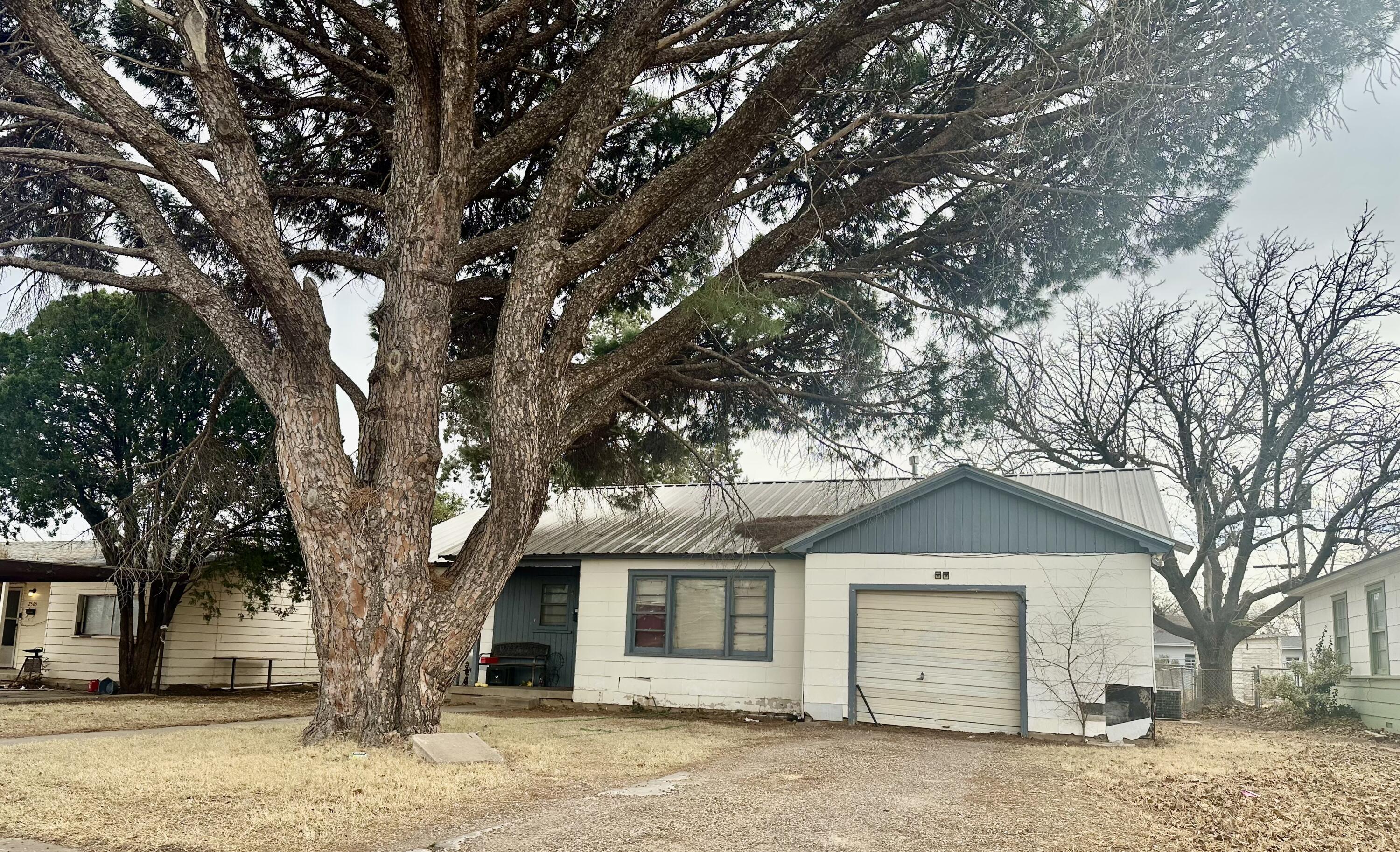 2507 39th Street Lubbock, TX 79413 - Photo 2 of 2 a front view of a house with a tree