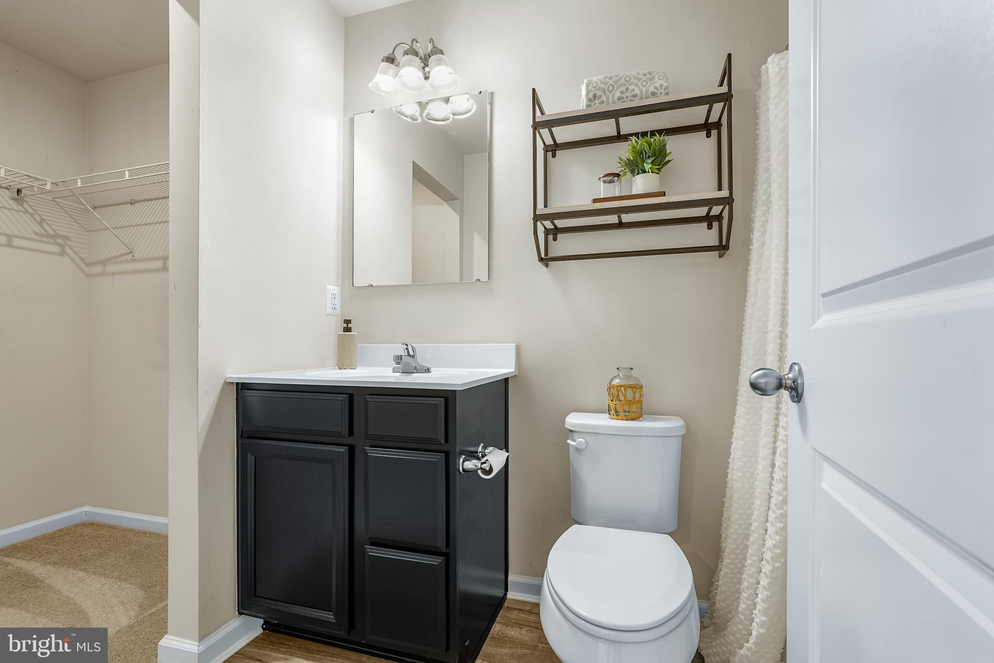 58 Azalea Circle Elkton, MD 21921 - Photo 19 of 33 a bathroom with a toilet a sink and mirror