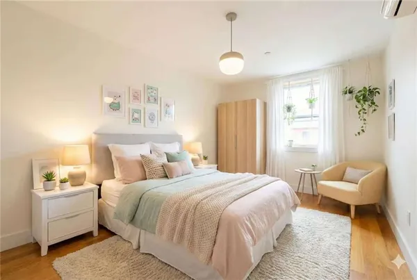 a bedroom with a bed and a couch