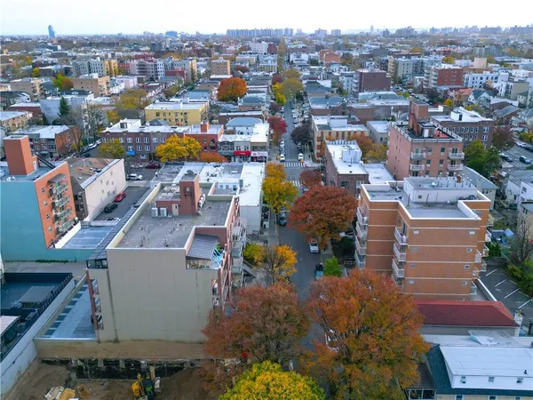 an aerial view of a houses with a swimming pool