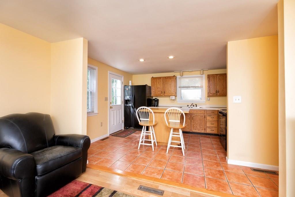 57 Christopher Road Rowley, MA 01969 - Photo 4 of 19 a dining room with furniture and a view of kitchen
