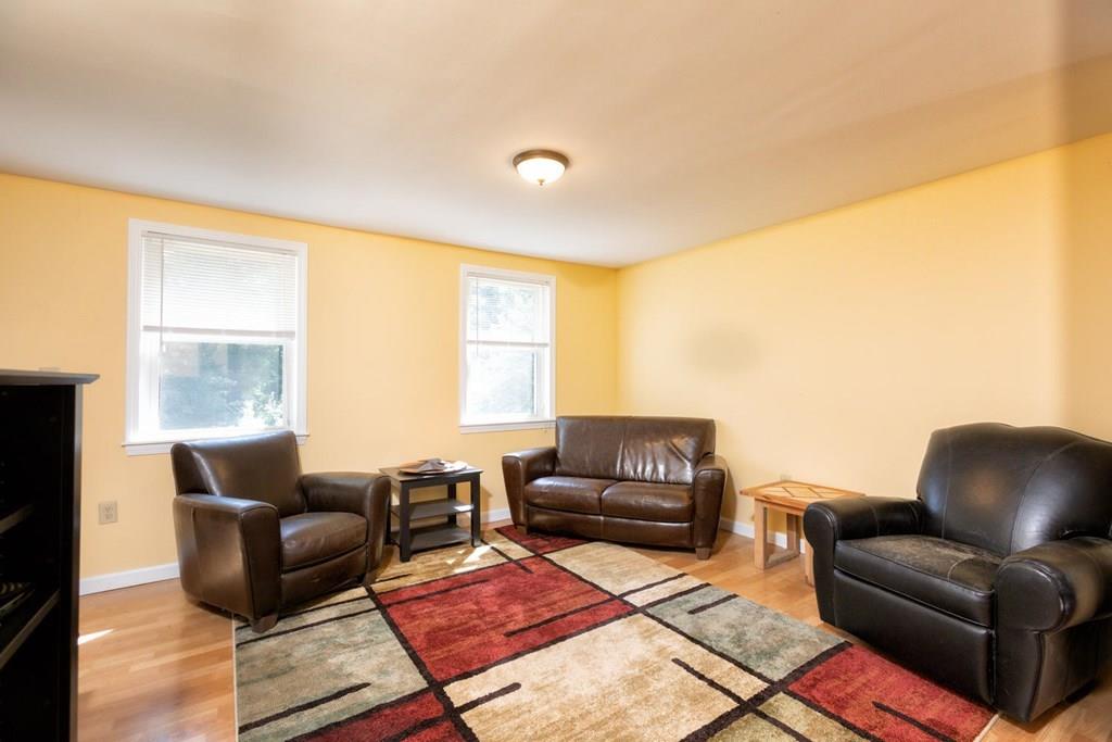 57 Christopher Road Rowley, MA 01969 - Photo 5 of 19 a living room with furniture and a large window