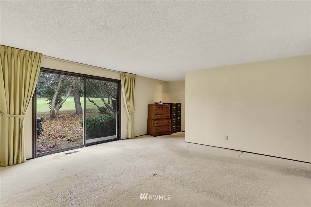 14811 Southeast 172nd Place Renton, WA 98058 - Photo 11 of 24 a view of an empty room with a balcony