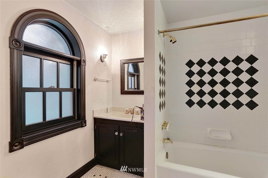 14811 Southeast 172nd Place Renton, WA 98058 - Photo 12 of 24 a bathroom with a bathtub and a shower