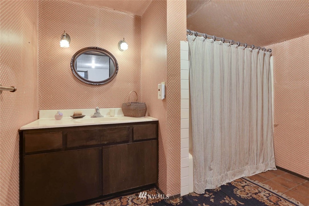14811 Southeast 172nd Place Renton, WA 98058 - Photo 19 of 24 a bathroom with a sink mirror and vanity