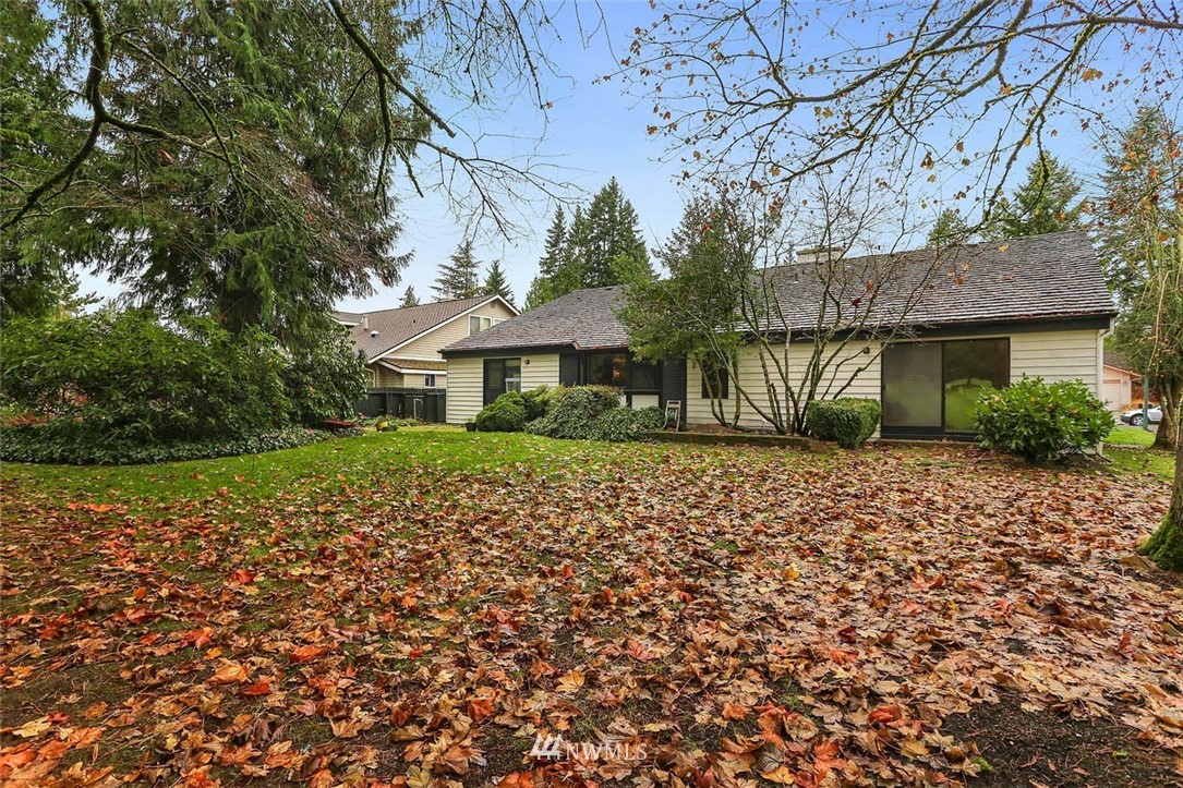 14811 Southeast 172nd Place Renton, WA 98058 - Photo 21 of 24 a front view of a house with a garden